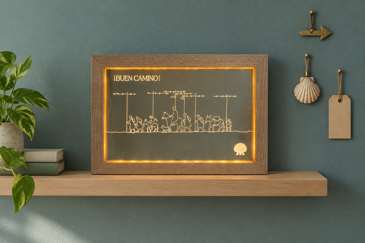 Pilgrim Artifact Alto del Perdón Camino de Santiago LED frame on a floating shelf against a green-grey wall.
