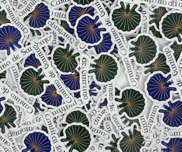 Pile of 20 Pilgrim Artifact Enlightened Pilgrim vinyl stickers featuring a Camino de Santiago design.