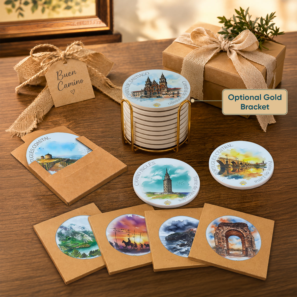 Camino de Santiago ceramic coaster gift set in a decorative tin box with ribbon, surrounded by multiple route coasters 