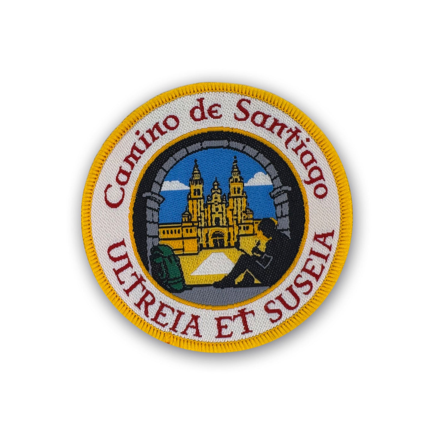Ultreia et Suseia patch showing pilgrim writing in journal under arch at Plaza del Obradoiro on white background
