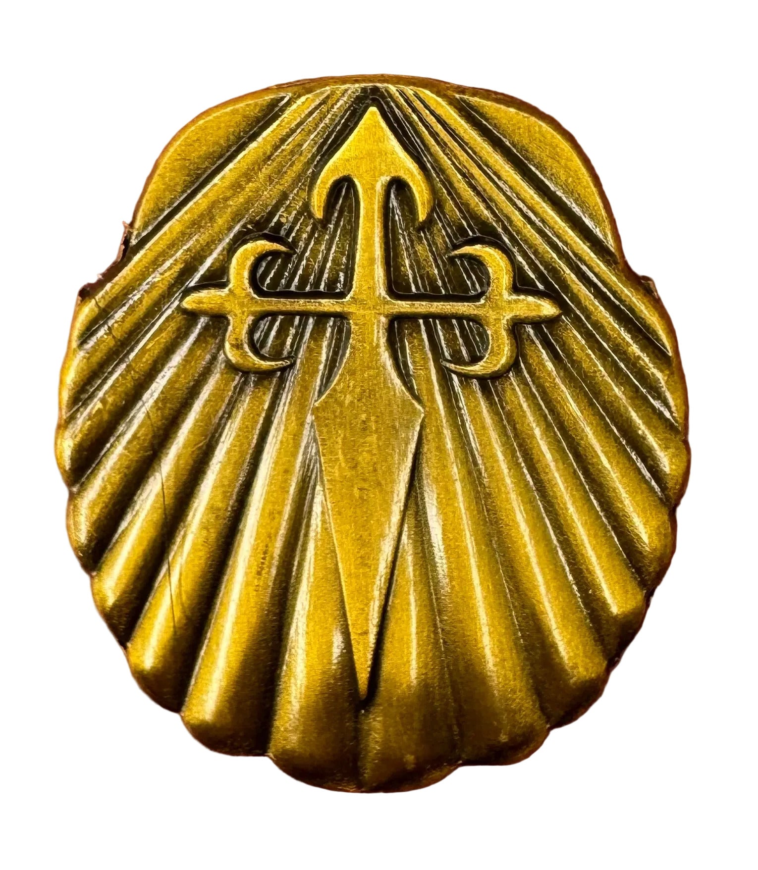 Brass Saint James medallion on a white background