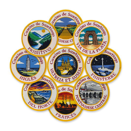 Nine circular woven patches depicting different routes of the Camino de Santiago on a white background.