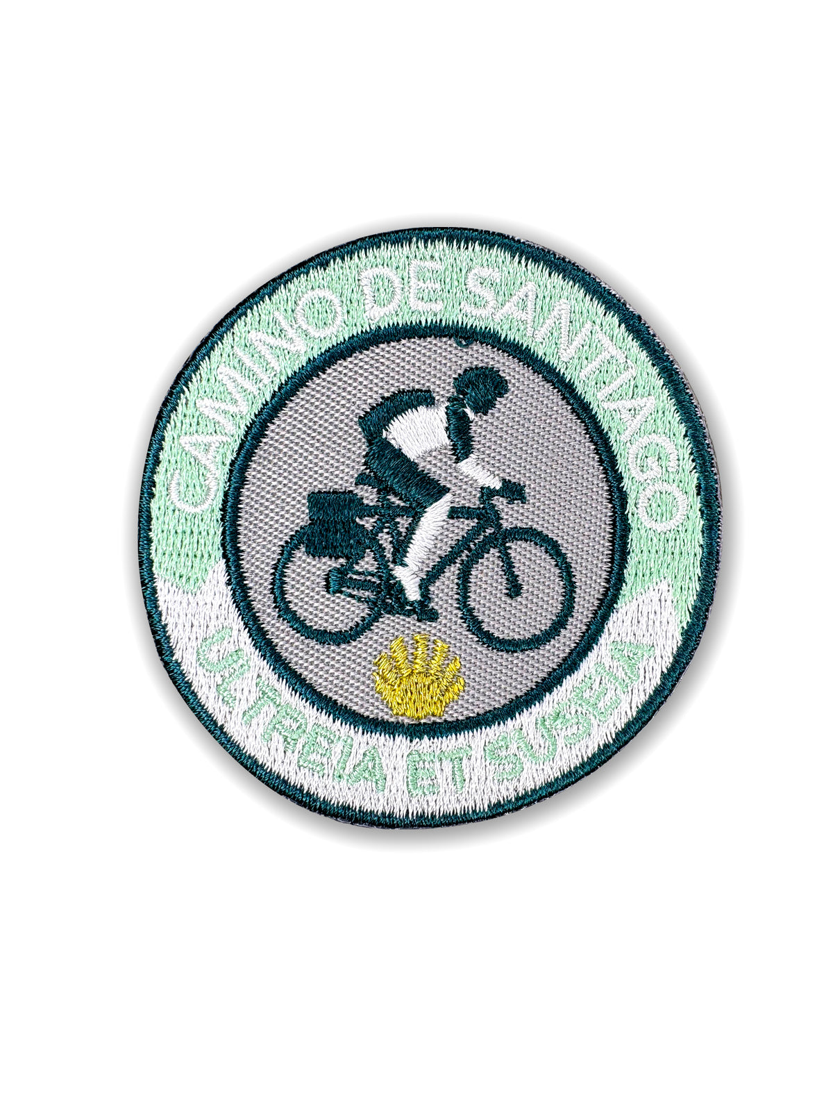 Pilgrim Artifact Ultreia et Suseia On Wheels embroidered iron-on patch featuring a teal cyclist on a touring bicycle, a yellow scallop shell, and a mint green and white Camino de Santiago border, shown on a white background. 